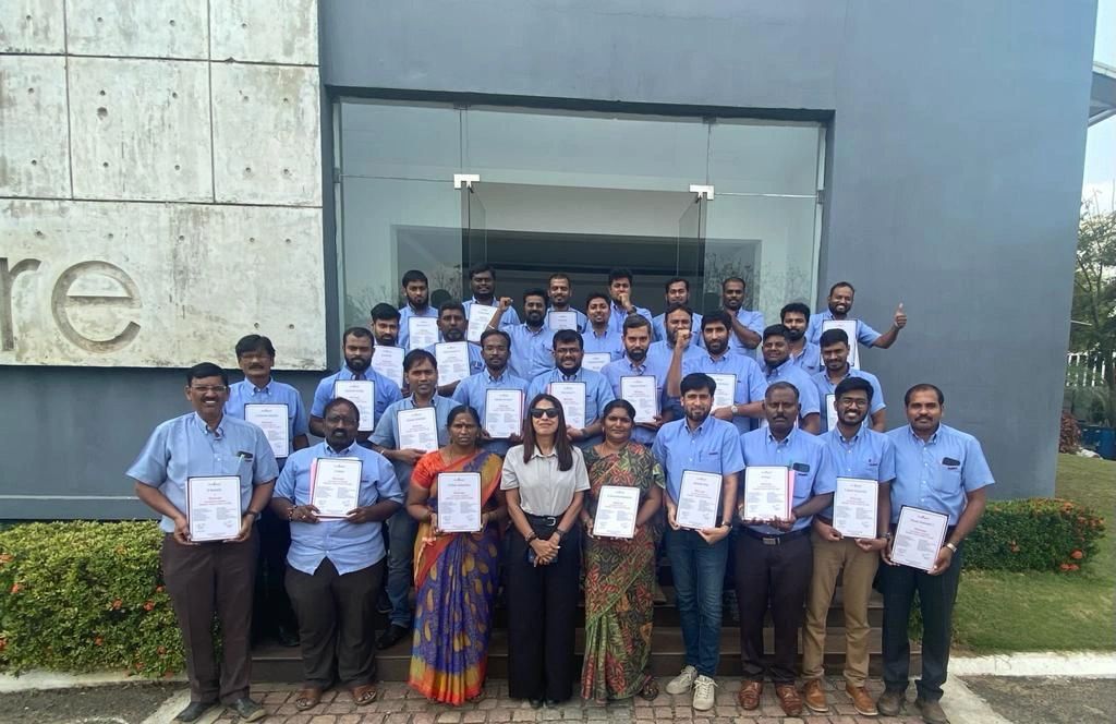 Bhavani with participants following a team development programme